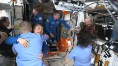 Moment of pure joy as stranded astronauts meet new crew after SpaceX capsule docks