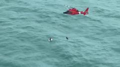 Moment US Coast Guard rescues man clinging to cooler miles from shore