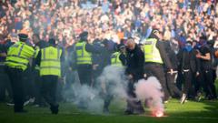 'Shameful' pitch invasion by Celtic and Rangers fans condemned by police