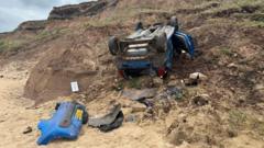Concerns over upturned car wreck left below cliffs