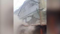 People flee as building collapses on Caracas outskirts