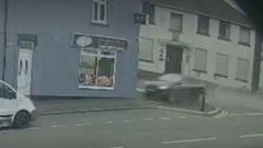 Two taken to hospital as car crashes into takeaway