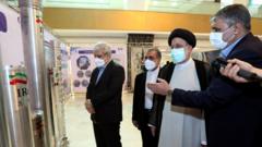 File photo showing Iranian President Ebrahim Raisi being shown uranium enrichment centrifuges at a conference in Tehran marking National Nuclear Technology Day (9 April 2022)