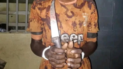 Hand of suspect holding the knife e allegedly use take stab im mama
