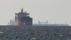 Ships hit in Strait of Hormuz as countries agree to release emergency oil reserves