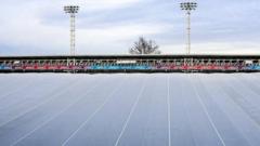 Heated cover used to stop football pitch freezing