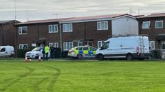 Neighbour's murder arrest after doorway fire