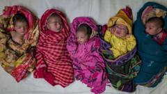 Newborn babies are placed on a hospital bed at a district hospital on 25 October 2022 in Noida, Uttar Pradesh, India.