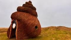 'Poo-shaped' sculpture defended by artist