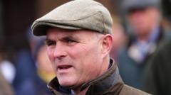 Horse racing trainer tried to help not hurt man - court