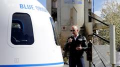 Jeff Bezos addresses the media next to the New Shepard launch vehicle