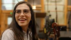 She travelled eight hours by bus for violin lessons. Now she's playing Wembley with Coldplay