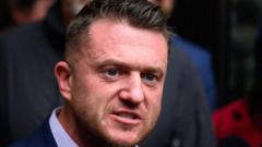 Tommy Robinson says he was stopped at Heathrow by police