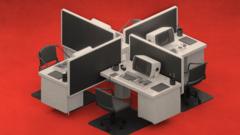 A retro modular style office set-up showing four desks and computers partitioned. The image has a red background