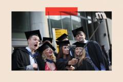 A group of graduates pose for a selfie