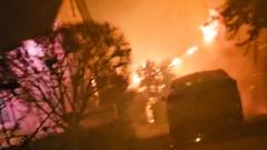 Watch: Moment man's saved from burning LA home