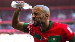 A Moroccan player pours water over his face