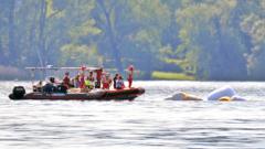 Carabinieri and fire brigade officers take part in the search and rescue operation in Lake Maggiore after a tourist boat capsized near Lisanza (Varese), northern Italy, 29 May 2023