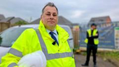 Man hires security to guard planning dispute wall