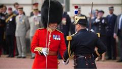 French guards at Buckingham Palace: Troops swap places in London and Paris