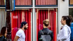 Tourists visit the ramparts in the Red Light District, Amsterdam