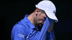 Injured Djokovic booed off after quitting Melbourne semi-final