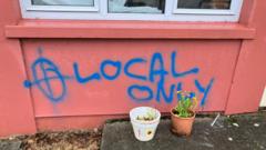 Sudanese family's home daubed with racist graffiti