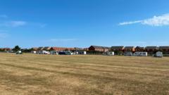 Football pitch caravan camp shifts to racecourse