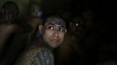 Members of Barrio 18 gang remain in a cell at the Penitentiary Complex in Izalco, El Salvador, 27 April 2020.