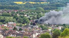 Huge smoke plume as shed fire spread to home