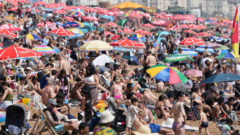 Sussex swelters as heatwave draws crowds to coast