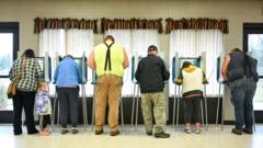 Exit polls: US voters name democracy and economy as top issues