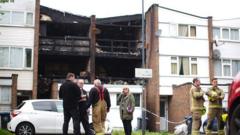 Murder arrest as mum and three children die in fire