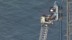 Watch rescue after rollercoaster stalls 100ft in the air
