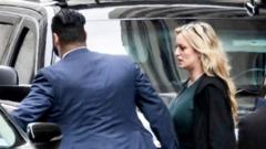 Stormy Daniels leaves after clash with Trump lawyer over sex claim