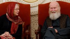 Son of British couple held by Taliban 'ecstatic' as they return to UK