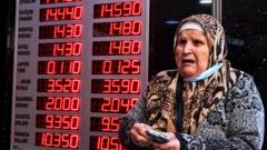 A woman checks rates on a board of the currency exchange office in Istanbul, Turkey, 02 December 2021