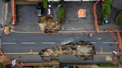 Man, 87, 'staying put' in home metres from sinkhole