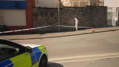 Man charged over double stabbing in street