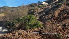Landslide hits beach and visitors told to stay away