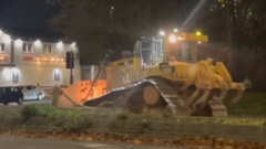 Charges after stolen earthmover driven across city