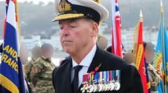 Moment man lays wreath dressed as fake admiral at Remembrance event