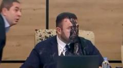 Watch: Georgia election chief doused with paint