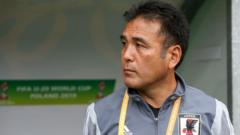 Japan football official sentenced for viewing child abuse images on plane