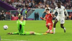 Tim Weah slots past Wayne Hennessey to give the US the lead