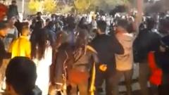 Protesters for di  north-western Iranian city of Sanandaj celebrate di elimination of Iran national football team from World Cup
