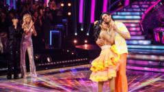 Strictly couple Balvinder Sopal and Julian Caillon dance while cheered on by hosts Tess Daly and Claudia Winkleman