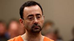 Justice department to pay survivors of Nassar abuse $138m