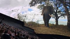 A showing of Postcard from Earth at Las Vegas Sphere. The scene shows an elephant, which towers over the audience.