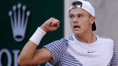 Rune wins thriller to book Ruud last-eight rematch